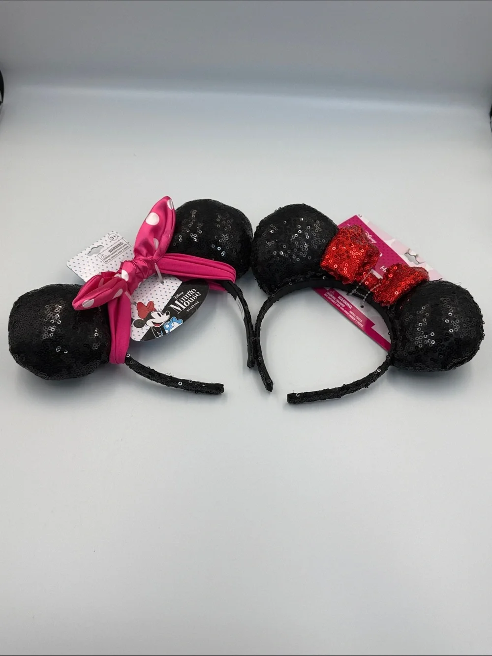 Disney (2 ) Black Sequin Minnie Ear Headbands with Pink and Red Bows
